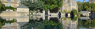Yale building reflected in a still pool of water