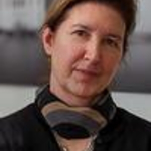 Adrienne Defendi wearing a scarf tightly fitted around her neck, black v neck shirt