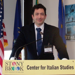 photo of Giuseppe Gazzola standing at Podium 