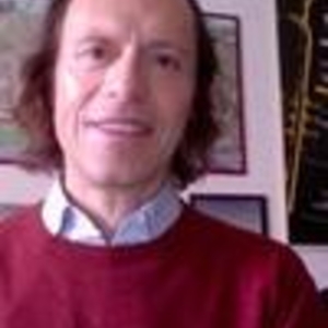 Federico Schneider wearing a red sweater with collared shirt