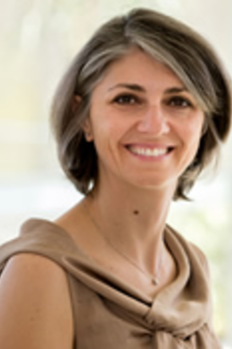 Barbara Garbin, wearing a brown sleeveless shirt 