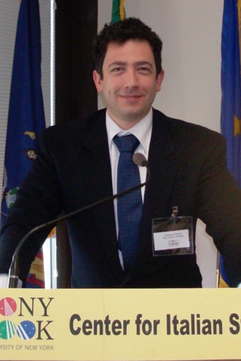 photo of Giuseppe Gazzola standing at Podium 