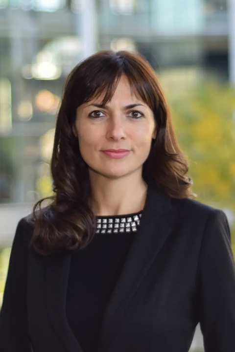 Maria Derlipanska standing in front of the School of Management