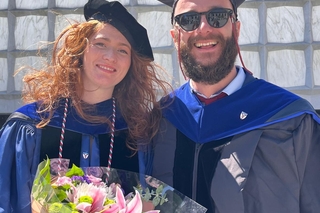 Costanza Barchiesi and Giacomo Berchi on commencement standing in front of the Beinecke Library