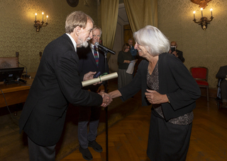 Jane Tylus receiving award